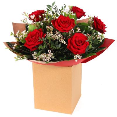 Crimson Romance - A striking bouquet of rich red roses, delicate white blooms and lush greenery, beautifully presented in a natural kraft box.
