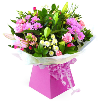 Pink Delight - A cheerful arrangement of pink lilies, roses and seasonal blooms, beautifully complemented by fresh greenery.