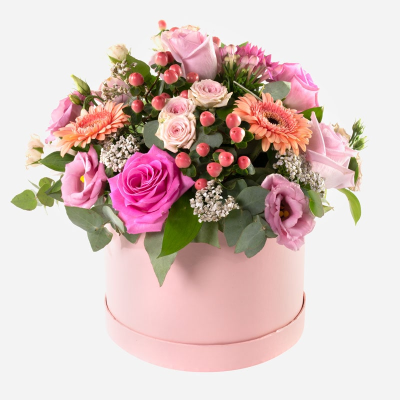 Pink Perfection - An elegant hat box arrangement filled with soft pink roses, peach gerberas, delicate blooms and fresh greenery.