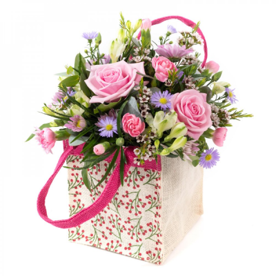 Sweet Sentiments - A charming arrangement of soft pink roses, carnations and lilac blooms, beautifully presented with fresh greenery.