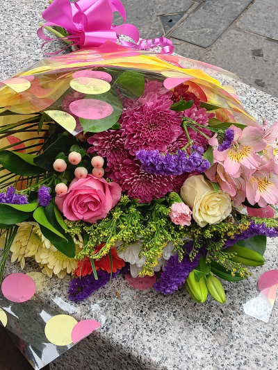 Berry Bright Wrap - A vibrant wrap filled with rich pink, purple and cream tones, beautifully handcrafted by City Florists in Inverness.